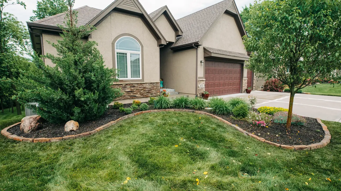 Front of a residential property with mature landscaping